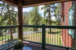 Patio offers views of the forested surrounding environment